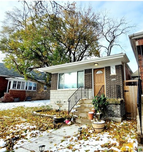 Photo of 320 W 101st Place, Chicago, IL 60628 (MLS # 12515405)