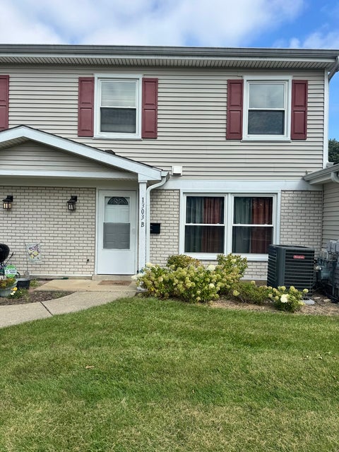 Photo of 1303 Kingsbury Drive #B, Hanover Park, IL 60133 (MLS # 12770210)