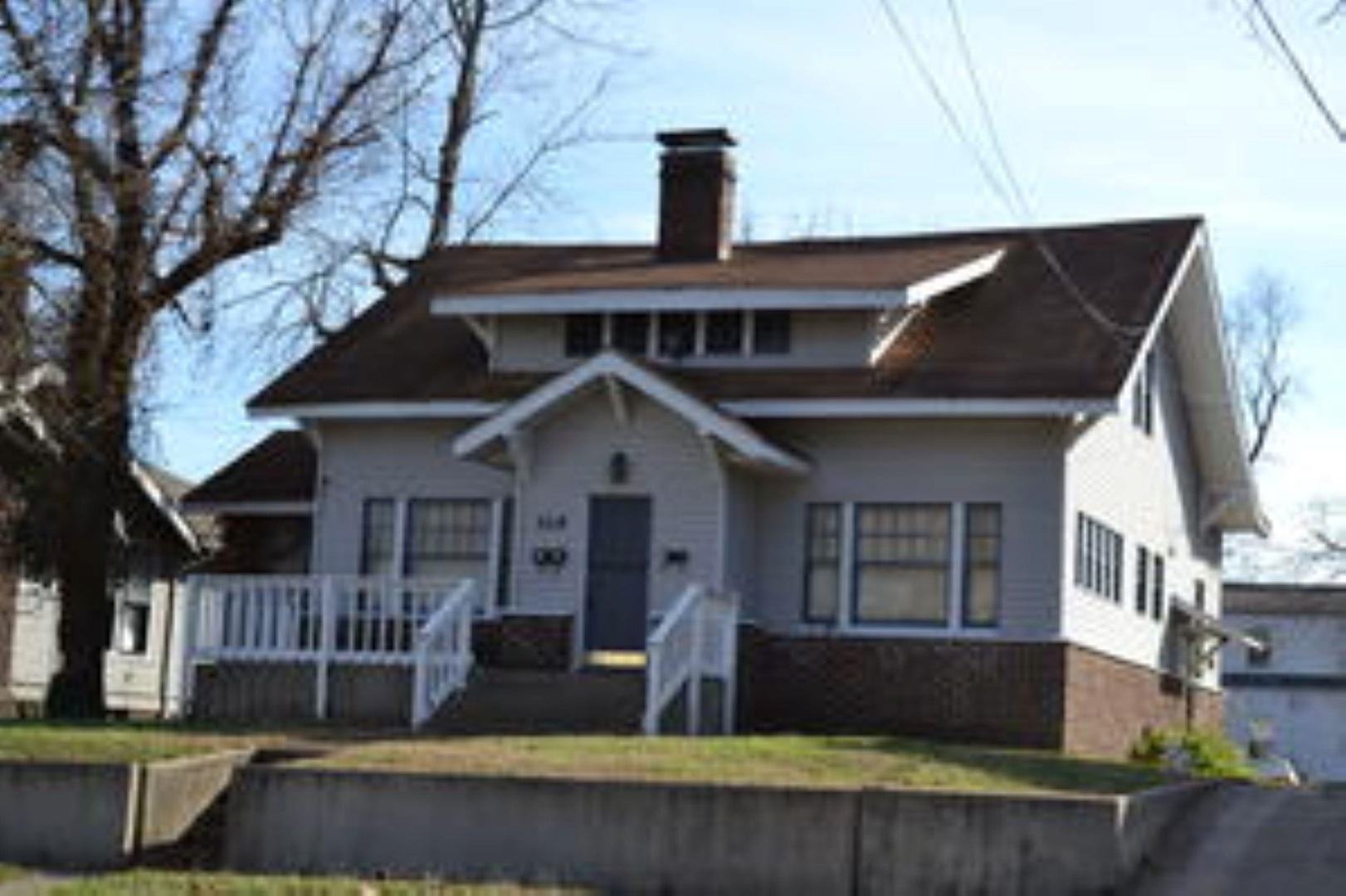 Bungalow-style house with a chimney