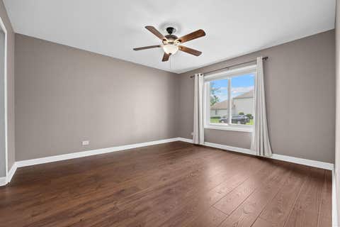 Tiny photo for 7050 Newport Drive #101, Woodridge, IL 60517 (MLS # 12692619)