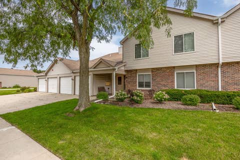 Photo of 7050 Newport Drive #101, Woodridge, IL 60517 (MLS # 12692619)
