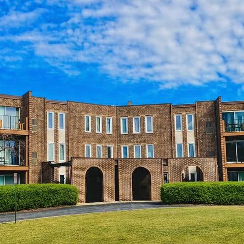 Photo of 1575 Sandpebble Drive #104, Wheeling, IL 60090 (MLS # 12630440)