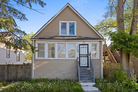 Photo of 1028 W 103rd Place, Chicago, IL 60643 (MLS # 12360438)