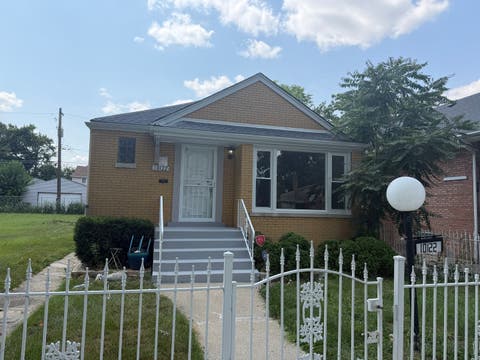 Photo of 10122 S WALLACE Street, Chicago, IL 60628 (MLS # 12719095)