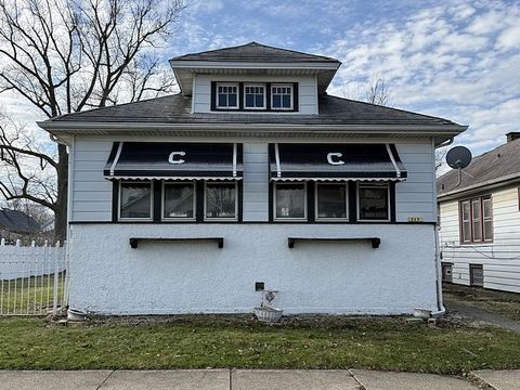 Photo of 317 W 103rd Place, Chicago, IL 60628 (MLS # 12598272)