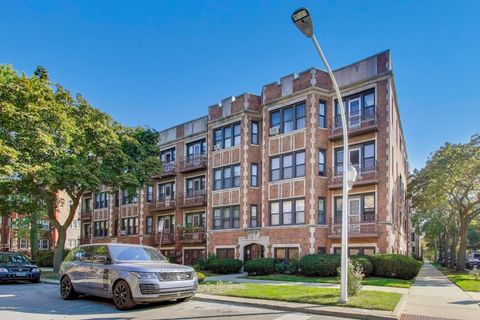 Photo of 6859 S Paxton Avenue #3, Chicago, IL 60649 (MLS # 12492318)