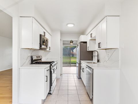 Tiny photo for 1916 Quaker Hollow Lane, Streamwood, IL 60107 (MLS # 12489861)