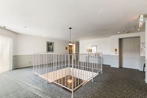 Tiny photo for 805 Leicester Road #211, Elk Grove Village, IL 60007 (MLS # 12584736)