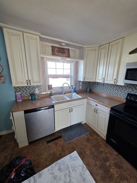 Tiny photo for 803 17th Avenue, Camanche, IA 52730 (MLS # 12624077)