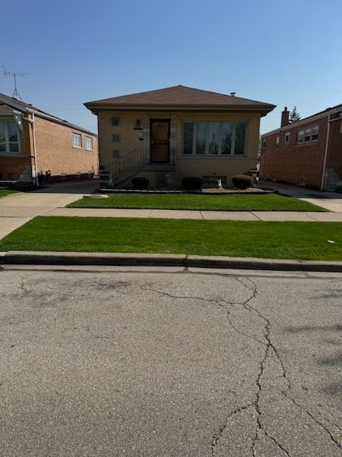 Photo of 4517 W 65th Street, Chicago, IL 60629 (MLS # 12661956)
