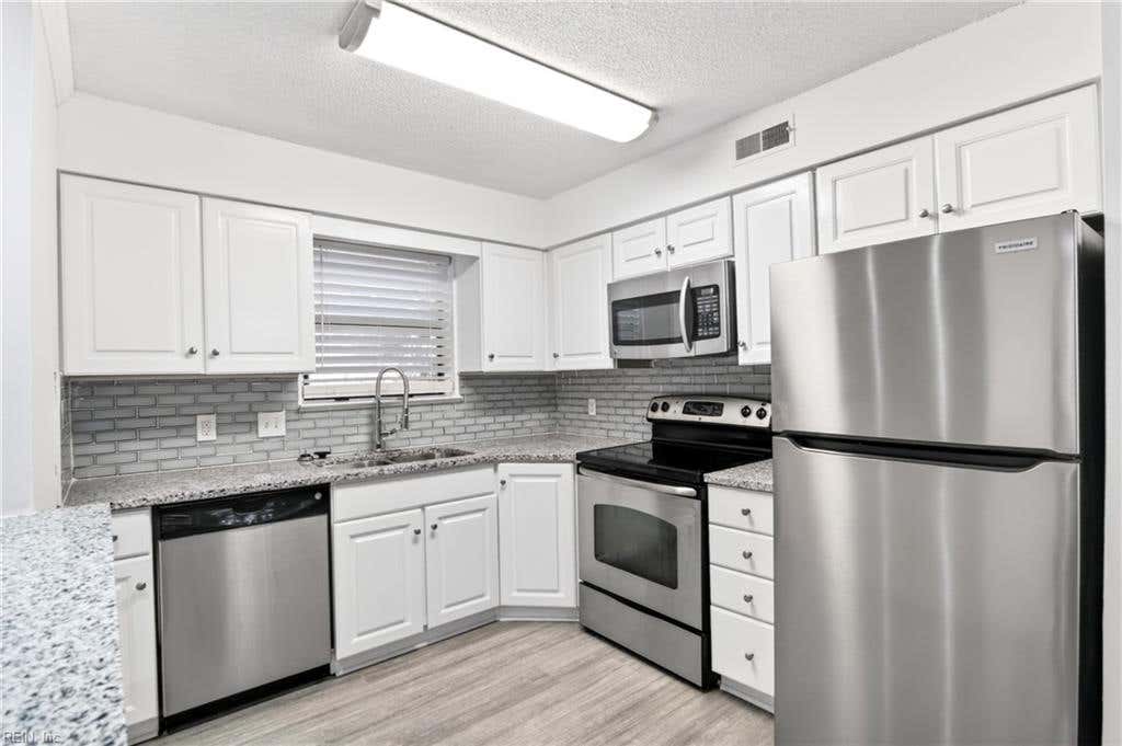 Photo of 149 Windsor Castle Drive #E, Newport News, VA 23608 (MLS # 10648876)