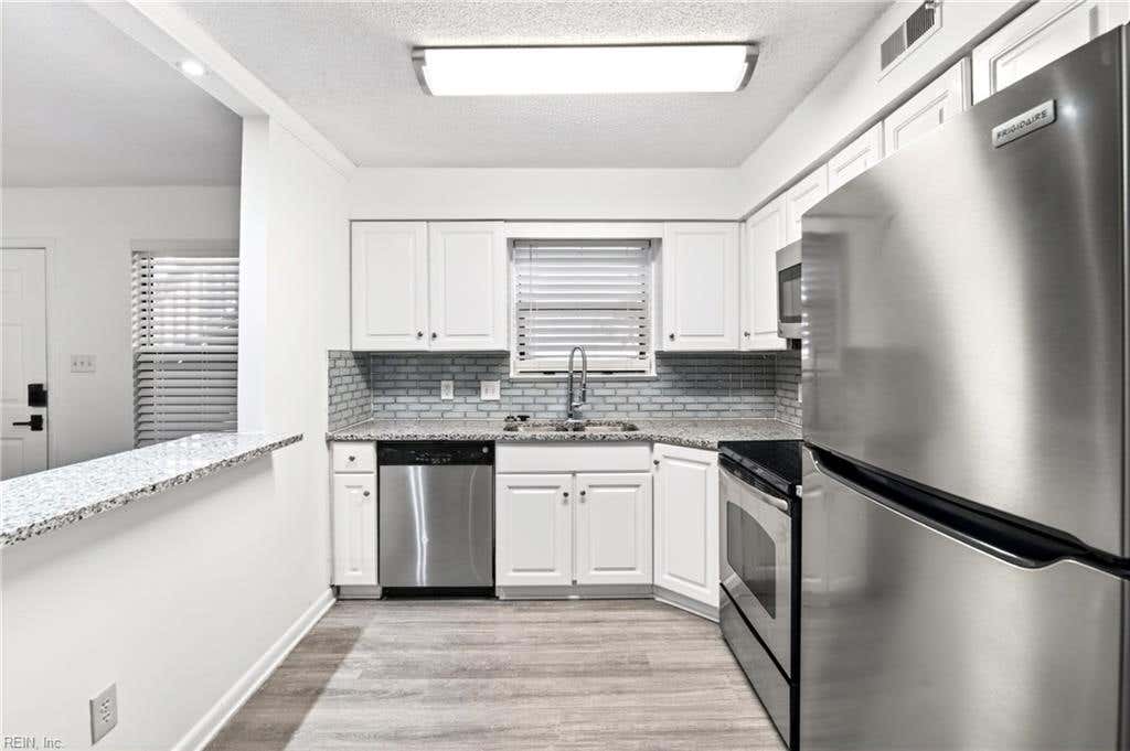 Photo of 149 Windsor Castle Drive #E, Newport News, VA 23608 (MLS # 10648876)