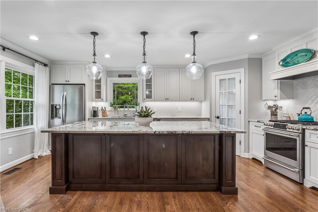 Perfectly positioned on a private, wooded .66-acre homesite overlookin – image 12