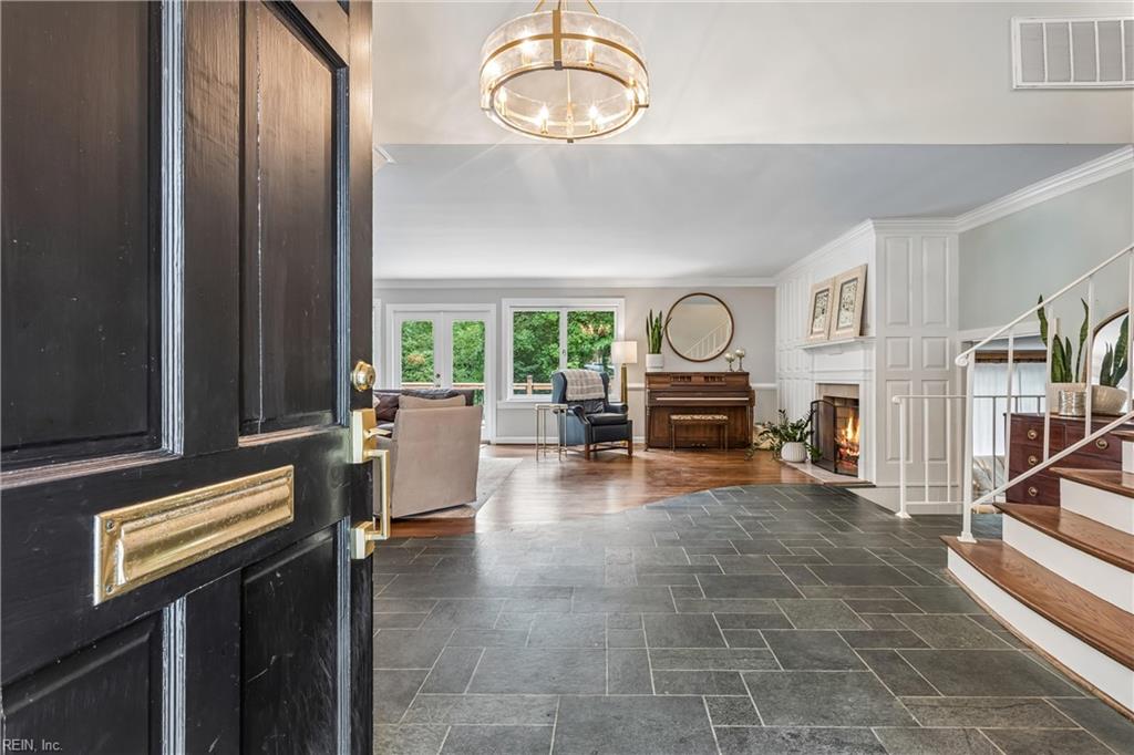 Perfectly positioned on a private, wooded .66-acre homesite overlookin – image 5