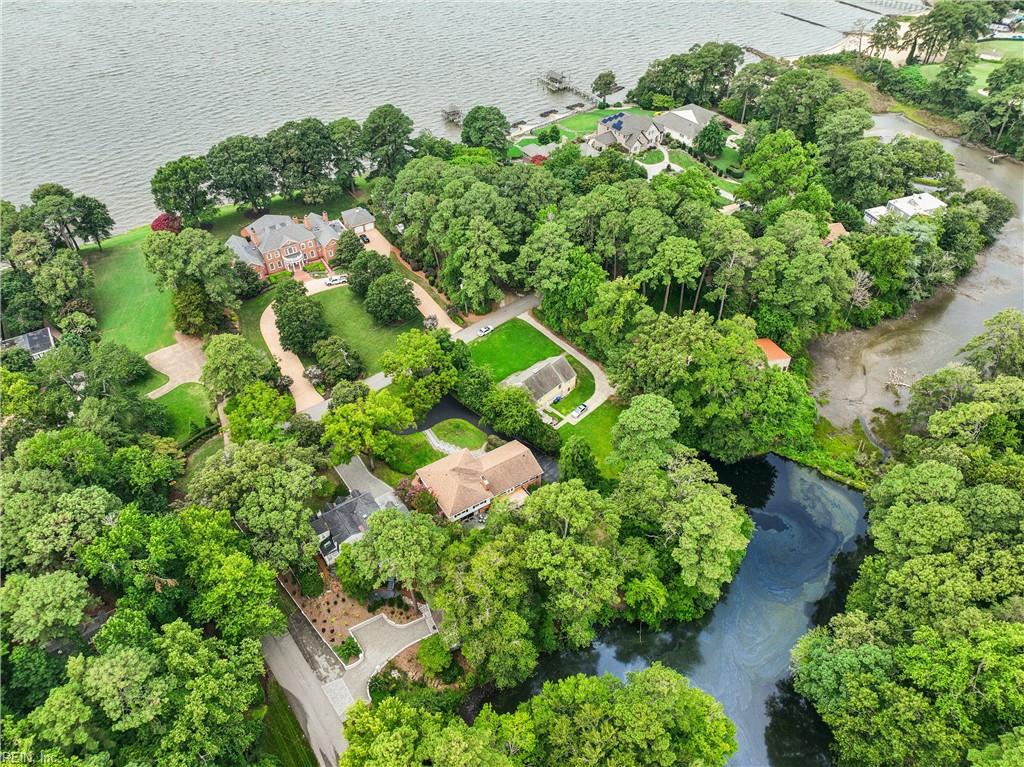 Perfectly positioned on a private, wooded .66-acre homesite overlookin – image 1