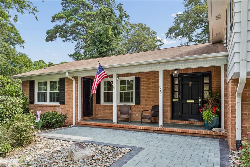 Perfectly positioned on a private, wooded .66-acre homesite overlookin – image 4