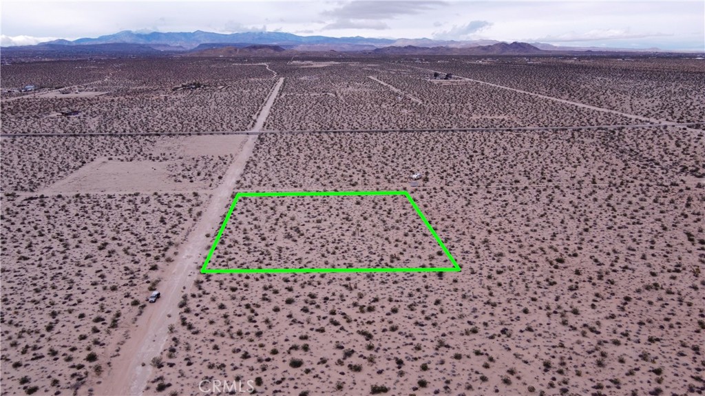 Break ground and build your dream home or homes on these flat lots! Let your creativity take front and take advantage of this desirable lot. This lot is just over 2 acres and is located in the secluded area of Joshua Tree but is still only 20 minutes from the park. Peaceful and quiet with expansive views for miles. Utilities are close by. Electricity is on Border avenue. Water connection is about 1,200 feet away