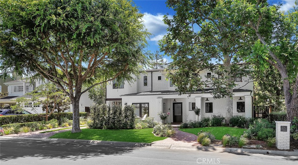 Nestled along the exclusive tree-lined streets of Cliff Haven, 327 Snug Harbor Road optimizes Newport Beach living. This iconic location is just a short walk or bike ride to all the local shopping, restaurants, trails and beaches. Recently remodeled with a designer's flair includes new flooring, tile, stone, plumbing and electrical throughout combined with new interior and exterior paint give this property the fresh coastal feel. A large covered patio along with natural gas fire-pit invites you into the residence. Four bedrooms - one on the lower level, craft room, office space, upstairs loft, convenient mudroom/laundry located off the covered carport and an upstairs bonus room that can easily be a 5th bedroom or your own private home gym. The chefs kitchen has a six burner gas range and double wall ovens, a massive island with bar seating, optimal counter space and a large window lined eat in dining area. The backyard has ample space for entertaining and lounging, an attractive wood trellis, brick fireplace, built-in BBQ and three tranquil water features creating your own personal oasis. The extra long gated driveway with freshly poured concrete allows for generous amount of parking which leads back to the detached two-car garage. The charm of this Newport Beach home will not disappoint.