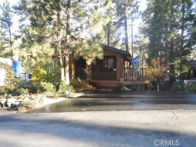 Magnificent log home with mountain charm and beauty. This awesome log home features 2 wood stoves, one in living room and 1 in the extra large master suite, laminate wood looking flooring in kitchen, dining, and hallway, wall to wall carpet in living room and bed rooms, Tongue and groove knotty pine wood walls and ceilings, Open kitchen and dining area with breakfast bar, built in range/oven and microwave, built in cabinet size wine/beer cooler refrigerator, beautiful wood kitchen cabinets. Guest bath features granite tile floor, tub/shower combination, large wood vanity, and 2 large bed rooms on main level with balcony off one of the bed rooms, the downstairs features a massive master suite with large bath and walk in closet and lots of storage. Front and side decks for warm weather relaxing under the large pine trees. The rear yard features 2 storage sheds for toys and garden equipment. Take the tour and feel the warmth of the lovely home. Association Amenities: None # of RV Spaces: 0 Special Features: BC,OBNONE Lot Location Type: Standard Location Landscaping: Natural Patio and Porch Features: Covered Deck # of Attached Spaces: 0 # of Detached Spaces: 0