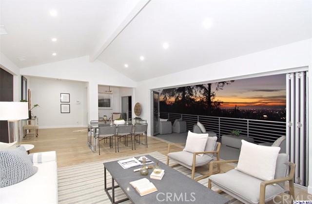 Redefine city living in this extraordinary 4bed/5bath multi-level home in the haute-couture Silver Lake Hills w/ epic views! Everything was taken down to the studs and rebuilt with immaculate quality and a sleek, fresh design. The open great room on the main level boasts oversized glass sliders allowing you to take in the scenery from the comfort and elegance of an open-concept living space. The floor plan effortlessly integrates a chic chef's kitchen with both upper and lower gathering spaces and private en-suite bedrooms. The master retreat offers direct and private access to one of the multiple oversized custom built decks overlooking endless panoramic views of city light skylines, Griffith Observatory and the historic Hollywood sign ~Perfect for summer cocktail parties and dining al fresco while sunset gazing! Below, lies a lush backyard ; your own secluded sanctuary to escape from LA w/ beautifully landscaped gardens, mature fruit trees, multiple lounge areas and a huge 4 car garage that could also double as creative space! All just a stones throw from vibrant DTLA and everything Silver Lake including trendy boutiques, restaurants & cafes in nearby Franklin Village & Sunset Junction!