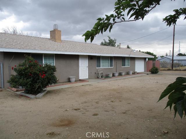 Very cute 2br. 1ba. starter home on 1/2 acre with a bonus room! Roof, stucco, & heater furnace all approximately 7 years new. Kitchen has been updated with granite counter tops, tile backsplash, and wood-look tile floors. Property is completely fenced with chain-link and then cross-fenced in wood for privacy in the backyard. There are three large wood sheds, two of which have electricity and can be used as workshops, or hobby rooms. There is RV access to the very large backyard area with lots of room for your toys, as well as a separately fenced in dog run. The front and back yards are shaded with lots of trees. It even has a pomegranate bush! Don't miss out on this one! It won't last long at this price! Association Amenities: None # of RV Spaces: 0 Special Features: TS,SH,WK,OBNONE Lot Location Type: Standard Location Landscaping: Partial # of Attached Spaces: 1 # of Detached Spaces: 0