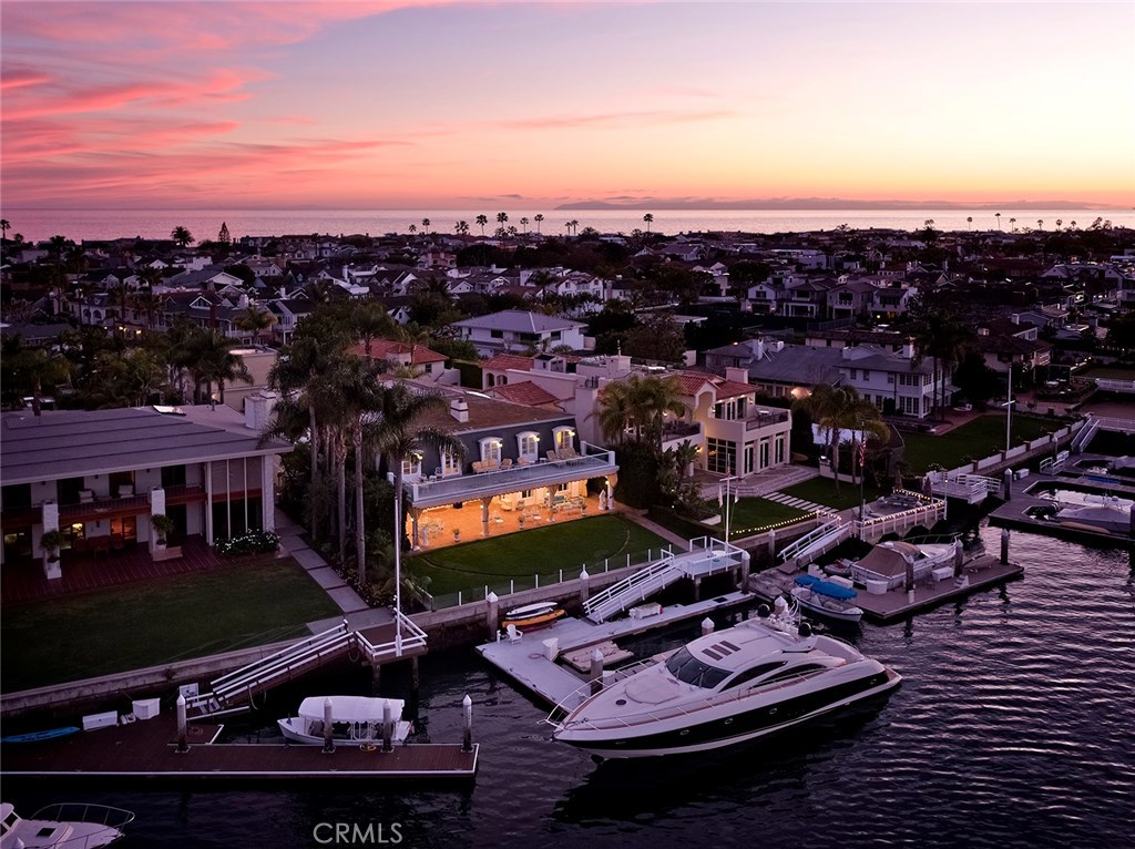 2104 East Balboa Boulevard presents a truly unprecedented opportunity to build your dream residence in one of Southern California’s most coveted locations. Situated on one of the largest lots on Peninsula Point, the property boasts sweeping views of the ocean and harbor, with close proximity to the wedge and some of the world’s best beaches. Plans for an iconic, contemporary work of architecture by Hudgins Design Group have already been approved by the Coastal Commission. These plans describe a residence that optimizes both the large lot and bayfront location — a multi-leveled estate with a subterranean garage, home theatre, rooftop deck, and 73-foot boat dock. Home to some of the world’s most discerning purveyors of luxury, Newport Beach offers the greatest combination of modern Southern California living — blessed with picturesque beaches, breathtaking sunsets, and a welcoming community, all encompassed in the perfect climate and natural beauty of the California Riviera. Representing the best of both worlds, this property offers a coveted bayfront Peninsula Point location, yet is only minutes from coastal Orange County’s best world-class dining, shopping, and five-star resorts. Welcome to your personal paradise.