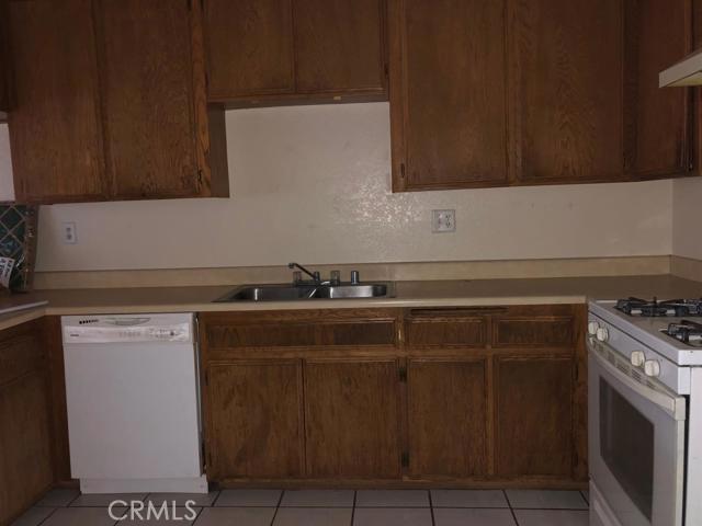 Cute 2 bed 1 bath unit. Bright, spacious living room with fireplace. Sliding doors open up to back yard and patio. Ample storage in the kitchen and good sized dining room. 2 car garage with laundry hookups in the garage. Water is on 1 meter for 3 units. Owner will split the bill equally 3 ways between the 3 tenants. Pictures are from a different unit, but same floorplan. Association Amenities: None Special Features: None