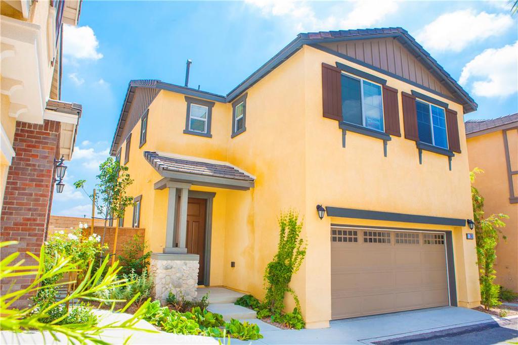 LOVEYLY TOWN HOME LOCATED IN THE CHARMING SERRANO COMMUNITY BY D.R. HORTON WHERE TREE-LINED STREETS, SWEEPING PANORAMAS AND THE BREATHTAKING BACKDROP OF THE SAN GABRIEL MOUNTAINS WELCOME YOU HOME. THIS 1685 SQFT TOWN HOME FEATURES 3 BEDROOMS AND 2.5 BATHS. THE KITCHEN FEATURES JAVA COLORED CABINETS, GRANITE COUNTER TOPS, STAINLESS STEEL APPLIANCES, VERY NICE UPGRADED DARK WOOD LAMINATE. CUTE PATIO OFF THE KITCHEN. THIS COMMUNITY IS ALSO JUST MINUTES AWAY FROM AN SCHOOLS, DINING AND SHOPPING.