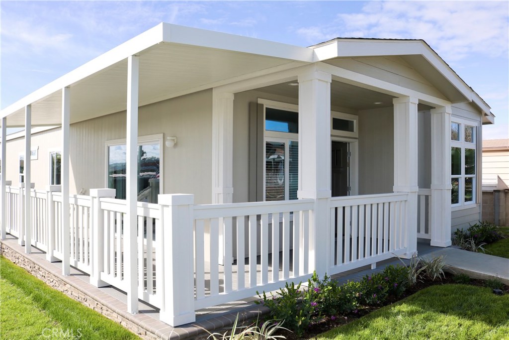 Senior Living 55 + This brand new custom 2 bed 2 bath home is located in a beautifully landscaped Senior Community. This Park has plenty to offer anyone who enjoys a quiet and friendly atmosphere.
As we enter this spacious home through the front porch we see a beautiful open concept. The great room features a stack stone entertainment center with book shelves on the sides. It is open to the spacious kitchen with a large island, great for food prep or entertaining. This home has stainless steel appliances. Gas Range, Dishwasher, 25 CF French Door Refrigerator. The kitchen has soft close doors and drawers and roll outs in the lower cabinets. There is a pantry to store your food and plenty of cabinet space. The dining area has plenty of windows which look out on the green belt and are great for natural light. All of the windows in the great room face the green belt and offer plenty of natural light! This home is an entertainers dream. Off of the kitchen is the laundry room with cabinets above the washer and dryer hook ups. Then moving down the hall two bedrooms plus the master bedroom with a walk in closet, ceiling fan and custom walk in shower and dual sinks in the master bath.