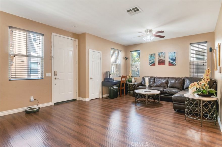 ***PRICE REDUCED $379,900.  Best Priced Home in Rialto!*** Home Features 5 Bedrooms and 3 Full Bathrooms and a Powder Room Downstairs.  Enter into the Spacious Family Room - Lots of Windows  with Custom Blinds.  

The Kitchen with Granite Counters and Newer Stainless Steel Appliances Opens to a Dining Area near the Patio with Sliding Doors.  Beautiful Upgrades: Newer Wood Flooring and Carpeting All thru-out, Custom Window Blinds, Ceiling Fans, Etc. Upstairs You'll Find a Spacious Loft that's Currently Used a Family Room/Theater Area with Extra Built-in Cabinets for Storage. The Masters Suite has a Balcony, Double Sinks, Separate Tub/shower and Walk-in Closet. There are Other 4 Bedrooms and 2 Full Bathrooms each with Double Sinks, Laundry Room with Built-in Cabinets. Home Also Features 3-Car Garages, Extra Parking, Community Pool in a Private Private Community of 75 Homes.