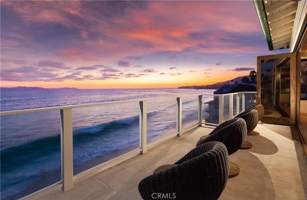 This magnificent oceanfront property designed by prestigious architect Paul McLean and masterfully built by Gallo Builders is truly one of Laguna Beach’s finest! Nestled on a bluff overlooking the Pacific, this stunning residence is the perfect family compound or investment opportunity. Each level’s floor to ceiling walls of folding glass and mahogany doors open to beach front patios creating breathtaking indoor/outdoor spaces to enjoy sea breezes, the sparkling ocean, sunset and Catalina views. Limestone floors on every level and patio along with mahogany windows and doors create a soft contemporary design and remarkably comfortable living space. The property features 8 bedrooms (7 ensuite), 9 bathrooms, 4 gourmet kitchens, a media room, multiple deck levels with bbq, al fresco dining and lounging areas, 4 fireplaces, air conditioning and 4 laundry areas. Plenty of room for multi-generation extended family gatherings! An extremely unique amenity is parking for up to 13 cars. A subterranean garage has 7 spaces, the upper garage has 2 spaces and there are 4 driveway spaces. The location of this trophy property provides access to absolutely ALL Laguna Beach has to offer. Enjoy walks along the water’s edge or the close proximity to Laguna village means a short walk to restaurants, shops and art galleries. This luxurious property can never be duplicated which makes it an opportunity of a lifetime. It's time to make 160 Saint Anns your dream come true residence!