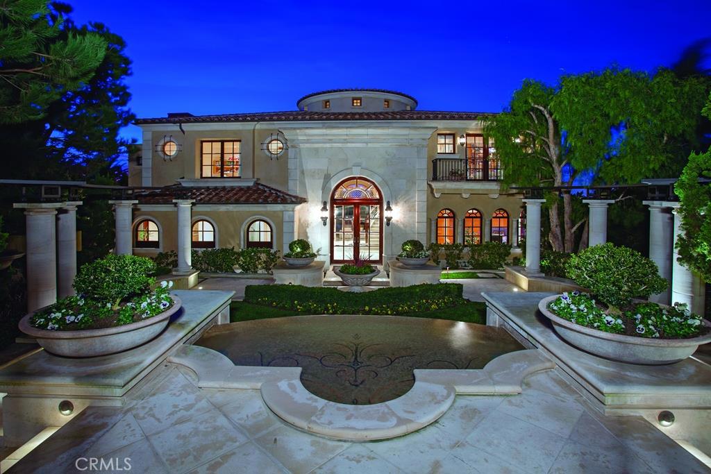 This contemporary estate is a masterpiece of graceful lines and clean elegant finishes. Located in the flagship neighborhood of Pelican Hill and situated on a pie shaped front row lot with views of Catalina, ocean, Palos Verdes, the Newport harbor and the 7th fairway. This estate encompasses all the necessary amenities such as a gourmet kitchen, catering kitchen,subterranean garage, theater, wine room, game room with bar, master retreat with sitting area and elevator that accesses all three levels to name a few. It is truly a work of art!