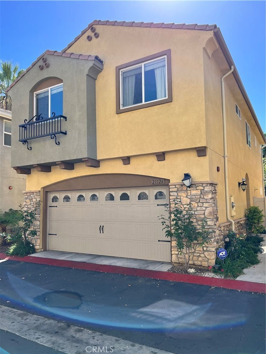 First time on market as a rental! Built in 2012, this Immaculate newer construction detached home is in a gated community with private park and playground. Nestled on a quiet street it features an open floor plan with 4 bedrooms and 3 baths. Modern kitchen with quartz counter tops, stainless steel appliances, filtered water, tile and laminate flooring. Living room leads to private patio/yard, surrounded by lush greenery. Upstairs master bedroom with private bath, double vanity sinks and spacious walk-in closet. 3 additional well proportioned bedrooms share a large bathroom with double vanity sinks as well. Freshly painted throughout. Upstairs Washer and Dryer are included in laundry room with cabinet storage. Two car garage has built in storage cabinets and is equipped with an EV charger. Home is close to Westfield Topanga and The Village