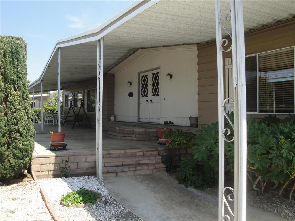 "Pembroke Downs" Family Park. Nice Double wide Mobile home just listed. Built in 1976 located in Chino very desirable Family Community. Very Spacious. Large Master Suite, 2nd bedroom has a joining bath,also features Double Door Entry, Dining Area with Built in China Cabinets, Formal living Room, Family Room/Den, updated Kitchen, Ceiling Fans, Dual Pane windows, Newer Window Blinds, Indoor Laundry area. Spacious Long Driveway/Carport. Nice Large Concrete Patio Area, with beautiful brick work. This home is located in a gated family community, with association pool, Spa, BBQ area. Beautiful Club House that can be rented for Family parties, features pool table,video & board games. This is a must see.