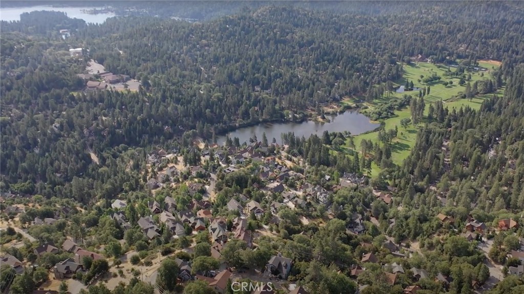 Lot 160 is a prime lot in Lake Arrowhead with Breathtaking Views & Lake Rights!!! Seize the opportunity to build your dream mountain retreat on this exceptional 9,129 sq. ft. lot in the Lake Arrowhead community. Tucked away in a peaceful and private neighborhood, this property offers stunning views of the lush golf course and serene Grass Valley Lake, creating a picturesque backdrop for your future home.
Enjoy full lake rights, granting you exclusive access to Lake Arrowhead’s crystal-clear waters—perfect for boating, fishing, and lakeside relaxation. Essential utilities, including water, electricity, and sewer, are readily available at the property line, streamlining the building process.
Immerse yourself in the best of mountain living within this tranquil and upscale enclave, all while being just minutes from local shops, dining, and year-round outdoor adventures. The lot next door is also available for purchase (Lot 159). Buy separately or combine both for expanded building potential, additional parking, a garage, and more!