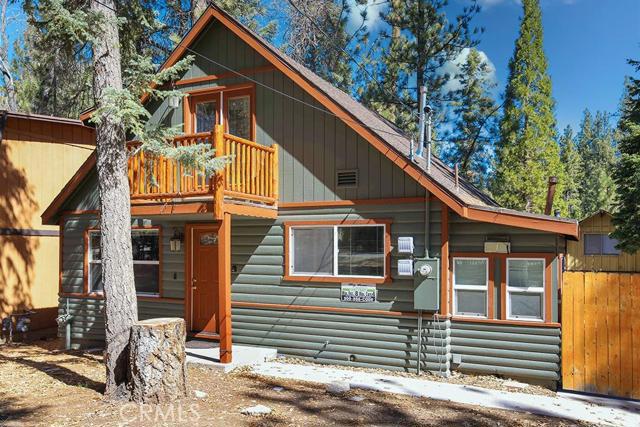 Welcome home! This stunning four-bedroom and two-bathroom cabin is found in the gorgeous location of Moonridge! Be located near town and neighboring the golf course, ski resorts, Moonridge Zoo, and numerous hiking trails in the national forest. Walk into your living room with an enclosed wood stove, great for family moments with mountain scenery outside your windows. Wood flooring and wood accents are found throughout, capturing the Big Bear feel. Outside, there is plenty of parking to cater to any RV or boat. This is a vacation rental location brimming with opportunities that will fit all your needs. See it today!