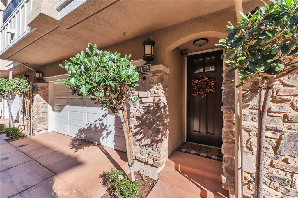 Located in the sought-after community of Solaire in San Elijo Hills, a beautifully modern unit is in move-in ready condition. Featuring 1,201 square feet of well-designed living space, 3 bedrooms, 2.5 bathrooms, and a 2-car attached garage with overhead storage, this home offers everything you and your family needs for comfortable and convenient living. Central air/heat. Upon entering, you immediately notice the upgraded stairway with Luxury Vinyl Planking. The open floor plan seamlessly connects the living, dining, and kitchen areas, creating an ideal space for entertaining family and friends. The main level also has 1 bedroom and powder room. The kitchen features stainless steel appliances, modern cabinetry, granite counters, tile backsplash, and a convenient breakfast bar, creating a functional and stylish space. Located off the living room is a private balcony. Upstairs, you will find the 2 additional spacious bedrooms. The primary bedroom boasts an en-suite bathroom, with walk-in closet, large walk-in shower, and dual sinks. Also located upstairs is a full bathroom with tub shower combination. Additionally, the community offers ample guest parking, ensuring hassle-free entertaining. The Solaire community is well maintained and offers a pool, spa, fire pit, loggia, and bbq’s surrounded by palm trees and mountain views. Located in the desirable town of San Marcos, this townhome provides easy access to a wealth of amenities. Enjoy nearby parks, hiking, bike trails, shopping centers, restaurants, and entertainment options, as well as highly rated schools.