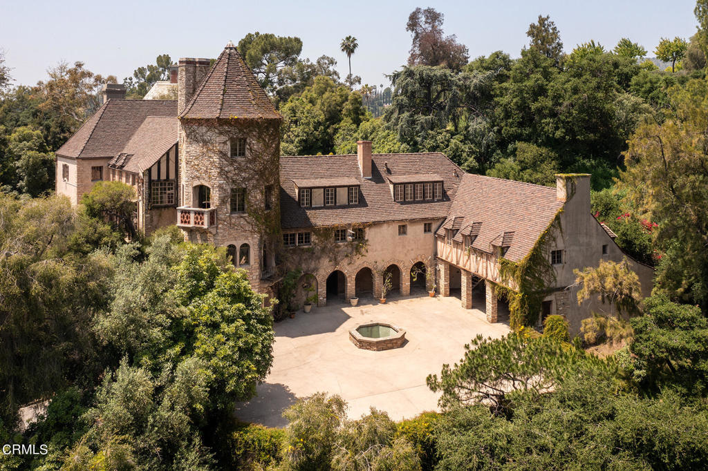 Significant architectural restoration opportunity. Private and palatial 1930 French Norman Estate designed by Marston & Maybury, 10,731+ sqft residence, strikingly elevated on a 2.1 acre promontory above Annandale Golf Club and accessed via long, ascending gated drive from North San Rafael Avenue. A true grandeur of yesteryear - spanning three main levels, with notable four story conical-roofed tower and separate garage wing with chauffeur residence. Opulent public reception, with Great Room and Solarium spaces providing space for regal entertaining. Commercial sized kitchen, adjacent staff quarters and laundry. Additionally; office study, library and large nursery room. Total bedrooms, 9. Total bathrooms, 10. Terraces, broad great lawn, swimmers pool, large motor court, wine cellar, workshop, safe room and cascading water fountain, to highlight a few. Masterfully crafted in 1930 with the finest materials, finishes and details - with most elements in their original, archived condition.