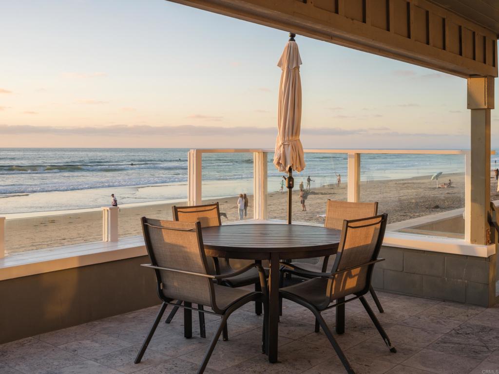 Rare oceanfront rental in Del Mar’s Beach Colony available October 1, 2025 - May 31, 2026. This fully furnished 3-bedroom home sits directly on the sand with sweeping ocean views from the living room, dining area, and kitchen. A newly remodeled oversized veranda offers the perfect space for outdoor dining and lounging, with private steps leading straight to the beach. Located just a short walk to Del Mar Village shops and restaurants. Parking for up to 8 vehicles which is an uncommon luxury at the beach.