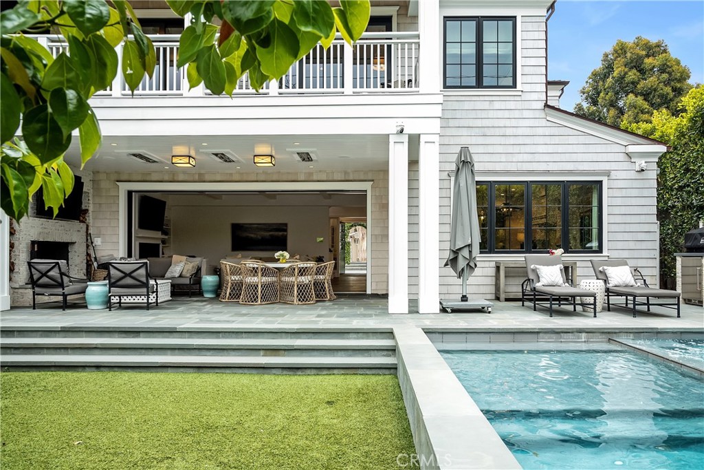 This rare property is perched on a level OVERSIZED, private corner lot of 8040 sqft with spacious yards, a pool & hot tub and views looking over the tree section to the hills of Malibu! It even has an ocean peek! This private, Hampton inspired 6523 sqft retreat was thoughtfully designed by Tim Clarke and meticulously constructed by RJ Smith Construction in 2019 featuring 6 bedrooms, ALL with ensuite bathrooms AND 3 additional bathrooms. The heart of the home features a double island kitchen with custom paneled Subzero refrigerator, freezer and deep beverage drawer, 60” Wolf duel fuel range, 2 warming drawers and microwave, a butler's pantry and a walk-in pantry. Large nook for casual dining. The great room with large wall pocketing, glass paneled doors open to indoor-outdoor living with a fireplace, Infratech ceiling heaters, spacious turf yard, pool with Baja shelf, automated safety cover, oversized hot tub and a waterfall feature that cascades into the pool. The primary suite opens from both the bedroom and bathroom to a private deck with fireplace and views. The primary bathroom, or "Wellness Center" includes, a steam shower, an infrared sauna, an ice maker for ice baths in the beautiful freestanding tub that opens to the private deck. The oversized primary closet is detailed with lighting and very special features you don't want to miss. Don't miss the gorgeous T&G and beamed high ceilings, paneled walls, and designer wallpapers. Ready for the muscle and additional amenities in this dream home ... A custom 400+ bottle wine cellar, 3 stop elevator, whole home water filtration system, Waterworks plumbing fixtures, Urban Electric and Visual Comfort light fixtures, Solar package with 3 Tesla wall batteries, Control 4 AV System, Lutron System with automated window treatments and custom black out shades, upgraded security with cameras, large upstairs laundry room with double stacked washers/dryers . Just too many features and upgrades to list. This property is truly a special, private retreat that lives like a home built to both entertain and to share quiet moments!