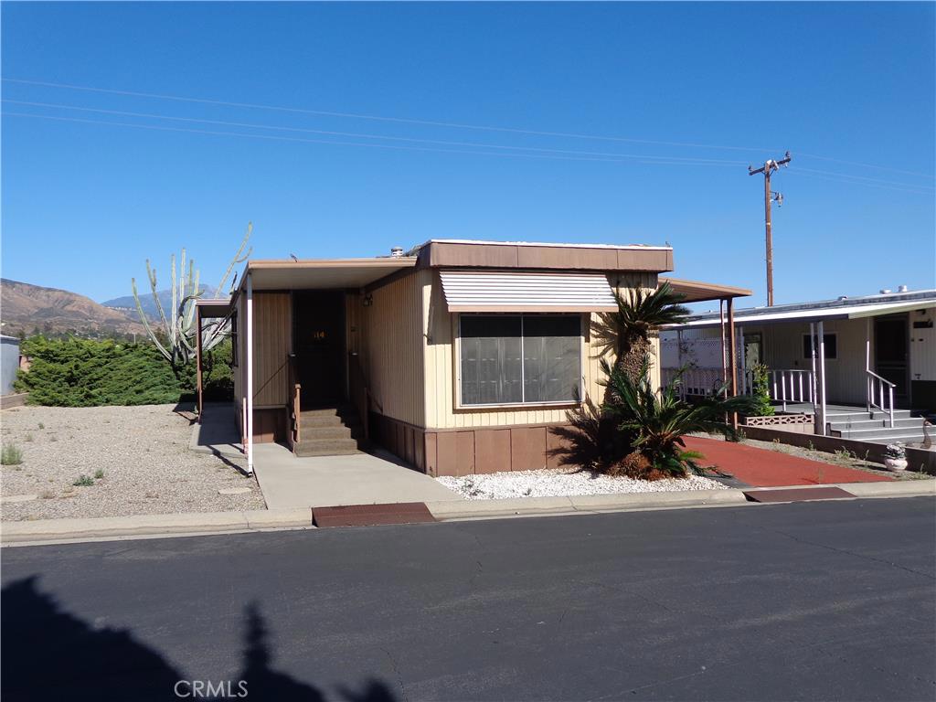 BEAUTIFUL 2 BEDROOM HOME IN HIGHLAND Two bedroom/one bath with double lavatories. Front kitchen with room for dining table and breakfast bar. BIG open living room with ceiling fan. 7x12 Expando Washer/dryer included. NEW carpets Carefree landscaping.