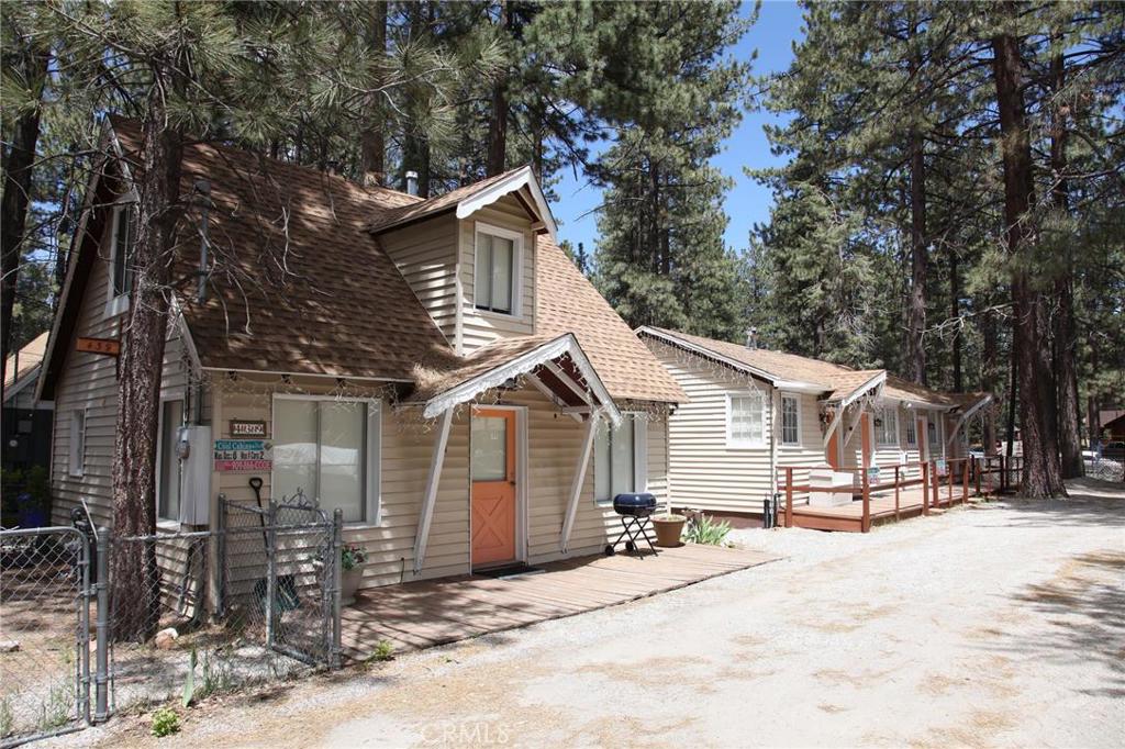EXCELLENT OPPORTUNITY ON THIS 5 UNIT MULTI-RESIDENTIAL PROPERTY ONE BLOCK FROM THE LAKE ~ CENTRALLY LOCATED ~ LIVE IN THE FRONT OWNERS UNIT & RENT THE BACK FOUR ON EITHER A FULL TIME OR VACATION BASIS TO HELP COVER YOUR MORTGAGE, OR RENT THEM ALL FOR ADDITIONAL INCOME! RECENTLY REMODELED AND COMPLETELY FURNISHED ~ TURN-KEY PROPERTY WITH GOOD RENTAL HISTORY.