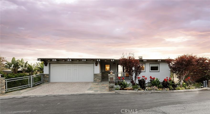 Welcome to 905 Canyon View, a custom Laguna Beach abode that blends contemporary refinement with casual seaside living. Artful finishes were carefully selected during the extensive renovation of this exquisite residence. Upon entering you are greeted by panoramic ocean, Catalina and white-water views which can be admired from all levels and all bedrooms. The naturally illuminated living and dining area flows seamlessly into an opulent kitchen graced with brilliant stone countertops, built-in Sub Zero refrigerator, Wolf double oven and 6 burner stovetop with griddle. Oversized and perfectly oriented windows maximize every inch of lush greenery, ocean and coastline views. The lines between inside and outside seem indiscernible with the expansive deck space that overlooks Pacific blues. The middle level offers a spacious bonus room and bar, guest bedroom, and the luxe primary suite. The home’s bottom level features a rare guest suite, accessible from both inside and the home's exterior which serves as the perfect mother-in-law’s quarters, studio, or private guest suite. It includes a living room with a fireplace, kitchenette, and full bedroom with designated bathroom. There is no home directly below the property which allows for unmatched privacy, minimal rooftop sight-lines and an abundant valley of views. The sweeping back yard is a rarity in Laguna Beach, showcasing a private enchanting garden, citrus trees, serene water features, and multiple lounge areas shaded by mature trees. As the sun sets, sights of golden sand, boats cruising, waves gently crashing, and city-light sparkle are juxtaposed against a rustic coastline for sensory overload. Minutes away from the best Southern California beaches, top-tier schools and the liveliness of downtown Laguna, 905 Canyon View presents the best of a California Riviera lifestyle and the opportunity to live every day as a vacation.