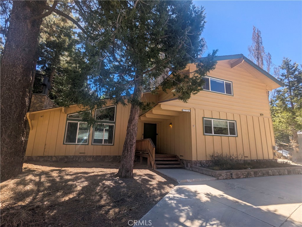 Welcome to your new home in the charming mountain town of Green Valley Lake! This spacious 3-bedroom, 2-bath retreat offers over 2000 square feet of comfortable living—perfect for a full-time residence or a relaxing vacation getaway. Windows throughout ensure a bright and cozy feeling. The Master bedroom has a walk-in closet, and there is a full bath on each floor. Newly renovated bathrooms and kitchen reflect the convenience of the modern, with the comfort of old-world charm. Enjoy a generously sized kitchen featuring many brand-new appliances, ideal for creating home-cooked meals and entertaining. A large, detached garage (660 sq ft) provides ample space for vehicles, storage, or a workshop. The back deck greets the sun and beckons family for a barbeque, or just a cup of coffee in the morning. Year-round adventure awaits with skiing at Snow Valley, just minutes away, plus boating, fishing, and entertainment nearby at Big Bear and Lake Arrowhead. A technological bonus includes a Vivint Home Automation Hub, House Alarm, and 5 outside home cameras. Be sure to come by and have a look!