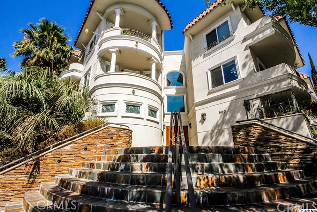 This luxurious condominium is truly Los Angeles living! Located in media city Burbank, with 2 bedrooms and 2 baths. Living room has built-in fireplace. Spacious dining area includes recessed lighting and balcony. Laminate wood flooring is throughout entire home. Kitchen features built-in stainless steel appliances, granite counter tops and breakfast bar! Laundry hookups are located in the closet and conveniently includes shelves. Master Bedroom and second bedroom both feature mirrored closet, recessed lighting, laminate wood flooring, and window- bringing in beautiful daytime lighting. Bathroom includes a dual vanity and shower stall. Second bathroom is updated, has shower stall with seat inside. Beautiful condo is ideally located in the center of popular Verdugo Mountain Park and The Los Angeles Zoo! Enjoy hiking, biking and exceptional mountain and city views at the Wildwood Canyon Park as well, just four minutes away! Also includes parking space in garage.