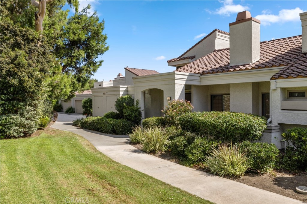 This charming two-bedroom, two-and-a-half bath townhome in the quiet, tree-lined community of The Villas at Rancho San Joaquin boasts an open concept floor plan with vaulted ceilings, large windows, and an abundance of natural light throughout the freshly painted living space. The ground level of the home enjoys an airy living room with plantation shutters, skylights, a fireplace, and wood-like flooring. A private enclosed atrium just off the dining room is perfect for morning coffee or entertaining guests. A sunny front patio with a brick hardscape provides an additional outdoor space to relax and enjoy the beautiful community landscaping. There is a powder room on the main level as well as an attached 2-car garage that conveniently allows for direct access into the home. On the second level, you will find two spacious bedroom suites both with new carpet. The Primary bedroom has a nice-sized walk-in closet, vaulted ceilings, and an ensuite bathroom. The secondary bedroom is also nice sized with its own bath. Fabulous community amenities include a pool and spa.
Zoned in the acclaimed Irvine Unified School District, including award-winning University High School. Ideally located near UC Irvine, Rancho San Joaquin Golf Course, Rancho Senior Center, Racquet Club of Irvine, William Mason Park, John Wayne Airport, beaches, Fashion Island & walking distance to shops & entertainment.