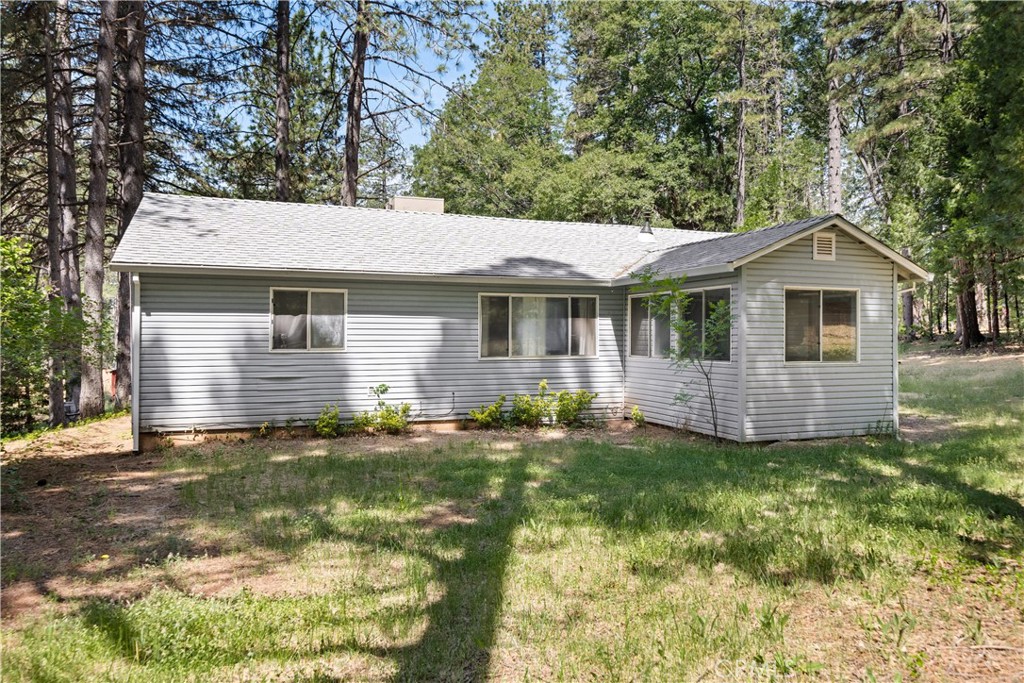 Tucked away in the pines, this Cohasset property is the perfect spot to escape the valley heat and have some elbow room and privacy! Just a short drive from Chico, this darling home sits on 3/4 of acre featuring 3 bedrooms, 2 bathrooms, a front entry sunroom, a spacious living room, and a split floorplan. On one side of the home is the master bedroom with an en suite and on the other side you will find two other bedrooms and another bathroom. The wood stove is ideal for staying cozy on cooler nights and the open living and dining spaces are a nice touch for entertaining or hosting. There is indoor laundry, a storage shed, and the yard offers a blank slate ready for you to grow a garden and create a backyard oasis to enjoy some peace and quiet. This property is affordable and ready for you to call home!