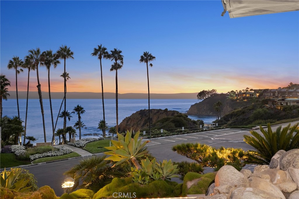 Set upon the finest non-oceanfront lot in the unparalleled enclave of Irvine Cove, this legacy home is on the market for the first time in nearly 50 years. Timeless mid-century architecture sets the stage for this design-driven property with interiors conceived by famed designer Fari Pakzad, with 4,524 +/- s.f. of interior spaces that feature clean lines & flowing natural light. Perched on an elevated bluff, this home commands exquisite white-water views of the Pacific, making it a rare gem, in an exclusive community. The elevated, oversized corner lot rises above street level, capturing the cool spray of salt air and provides a private vantage point where stunning sunsets become the backdrop of an extraordinary lifestyle. Expanses of glass look out on rugged cliffs & ocean swells in the living & dining rooms, and the kitchen connects to an immense lounge area with wet bar, where oversized skylights create the feel of a luxe atrium. Four spacious bedrooms include 2 rooms that open to a spa patio, an additional guest room and a master suite in a separate wing that offers whitewater views, incredible closet space & an ensuite with natural light. An outdoor entertaining space with sweeping views has covered seating, a bar & BBQ kitchen, and a gated motor court securely accesses garaging for 5 cars. The crown jewel of Laguna Beach ocean bluff communities, Irvine Cove is guard-gated, with exclusive access to tennis courts, and a pristine private beach a short distance from the bluff.