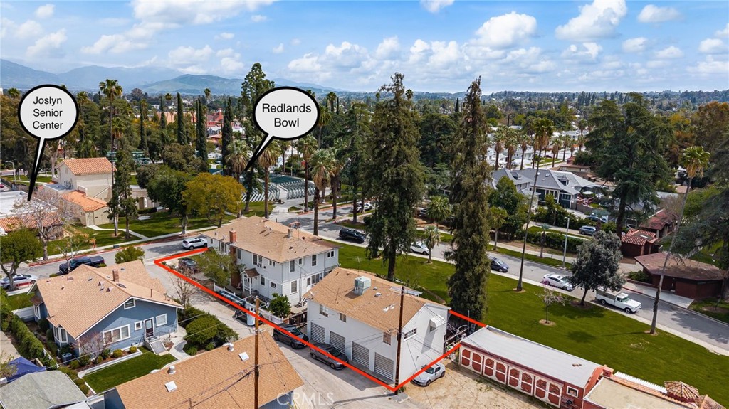 Seven unit apartment complex with two separate buildings, four garages, private yard for tenants, and coin laundry - located directly across from the historic Redlands Bowl and Jocelyn Senior Center, one block from the AK Smiley Public Library, and adjacent to Smiley Park. On the market for the first time in over fifty years, 'The Prosellis' apartments offer a unique opportunity for either a live in owner, or an investor who is looking for an A+ location with rents that are currently under market rate. Our front building consists of four one bedroom units, two studios, and a common laundry area (est. 3484 sq ft). The back building (est. 1134 sq ft), which has it's own private yard, is a two bedroom apartment located on top of the four separate garages. A basement underneath the front building provides ample storage space for ownership, and easy access to systems like water heaters, plumbing, and electrical. The four garages open up to the alley. Excellent Redlands Schools.