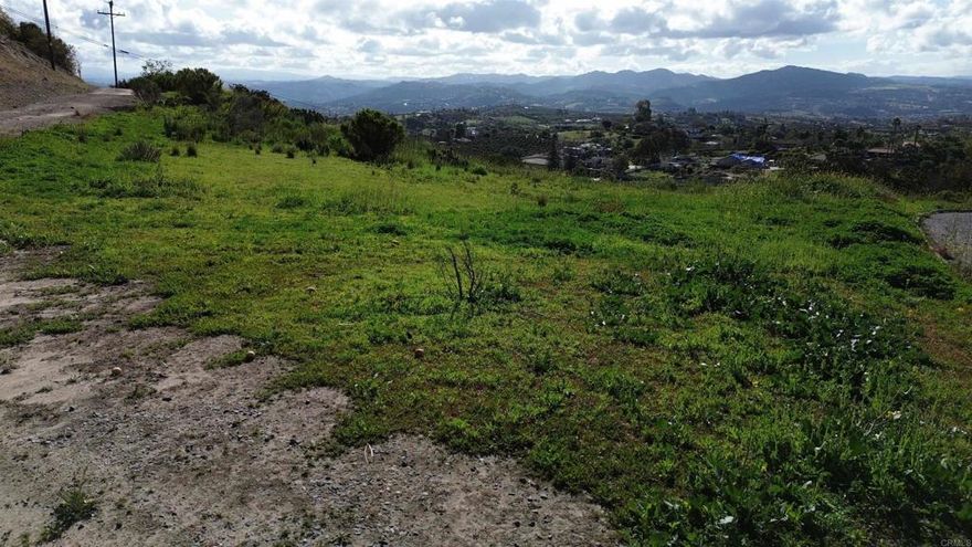 Panoramic Paradise in Fallbrook! Discover the perfect canvas for your dream home on this breathtaking 2.68-acre hillside lot in Fallbrook, CA. With sweeping panoramic views and a serene location, this property offers an unmatched opportunity for privacy and tranquility.  This buildable lot is primed and ready, with much of the pre-construction planning already completed—saving you tens of thousands in costs. Whether you envision designing your own masterpiece or utilizing the existing building plans, the choice is yours!  Situated in one of Fallbrook's most picturesque settings, this property provides an unbeatable combination of natural beauty, convenience, and value. Don’t miss out on this rare opportunity to bring your vision to life and create the home you’ve always dreamed of.